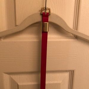 Bright red skinny belt